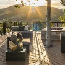 The sun shining on a newly installed deck overlooking a mountain view installed by Lamorinda Deck Installer