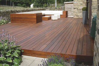 Showing a large outdoor couch on a beautifully stained deck by Lamorinda Deck Installer