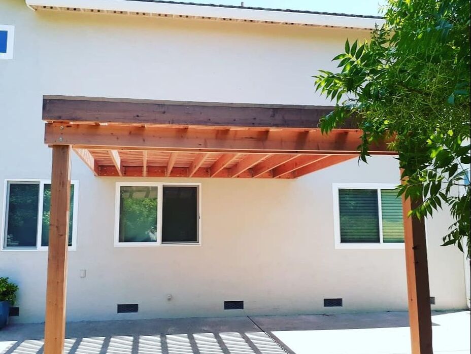 An outdoor structure covered by a pergolainstalled by Lamorinda Deck Installer