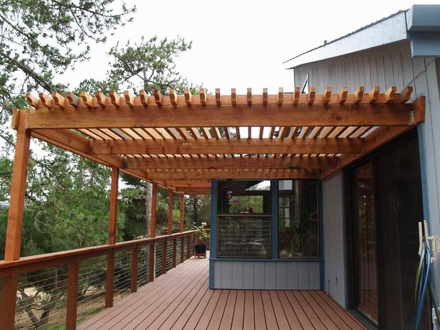 An outdoor entertaining deck with a pergola installed by Lamorinda Deck Installer